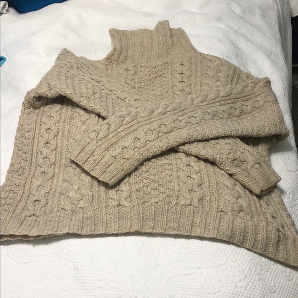 cream wool turtleneck cable-knit sweater